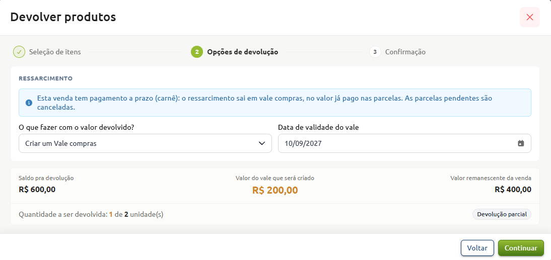 Etapa de opções de devolução no sistema de vendas, configurando ressarcimento via vale-compras com data de validade para uma devolução parcial, exibindo o saldo para devolução de R$ 600,00, o valor do vale de R$ 200,00 e o valor remanescente da venda de R$ 400,00.