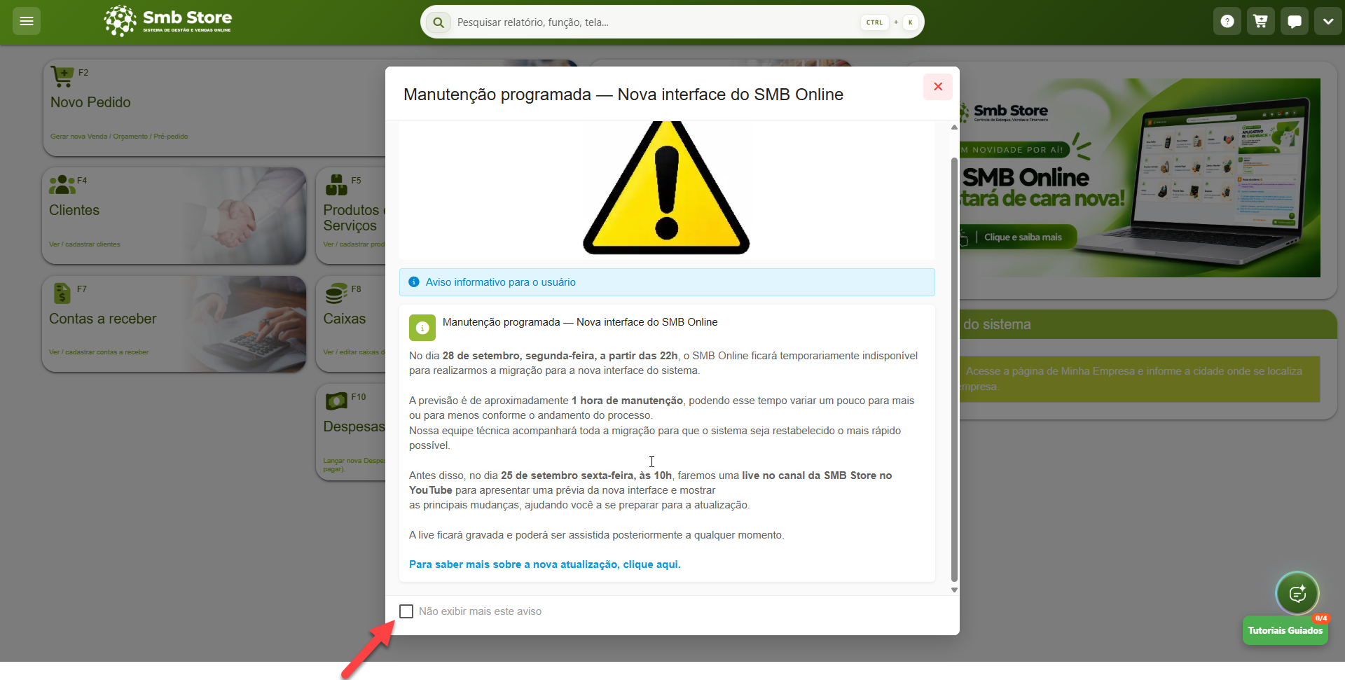 Tela do sistema SMB Store exibindo uma janela sobreposta com aviso de manutenção programada para a nova interface do SMB Online, com detalhes sobre a data e o horário da indisponibilidade, link para transmissão ao vivo e uma caixa de seleção destacada na parte inferior para não exibir mais o aviso.